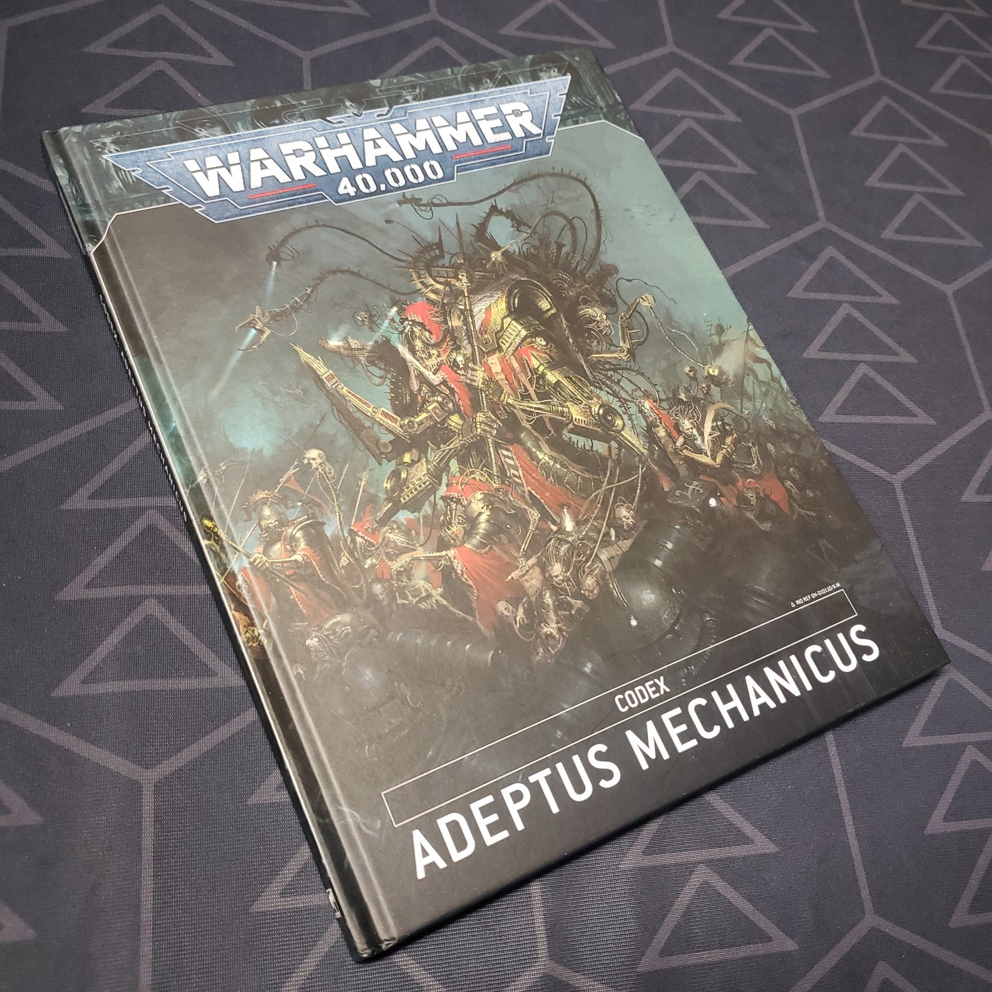 Image shows the front cover of the Warhammer 40,000 (Ninth Edition) Codex: Adeptus Mechanicus wargaming book