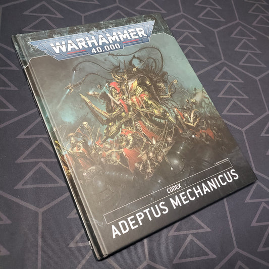 Image shows the front cover of the Warhammer 40,000 (Ninth Edition) Codex: Adeptus Mechanicus wargaming book