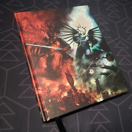 Image shows the front cover of the Warhammer 40,000: Ninth Edition Core Rulebook (Indomitus Full Art Cover) wargaming book