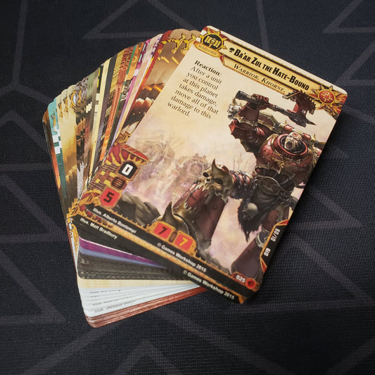 Image shows the cards for the Boundless Hate expansion for the card game Warhammer 40K Conquest fanned out in a stack
