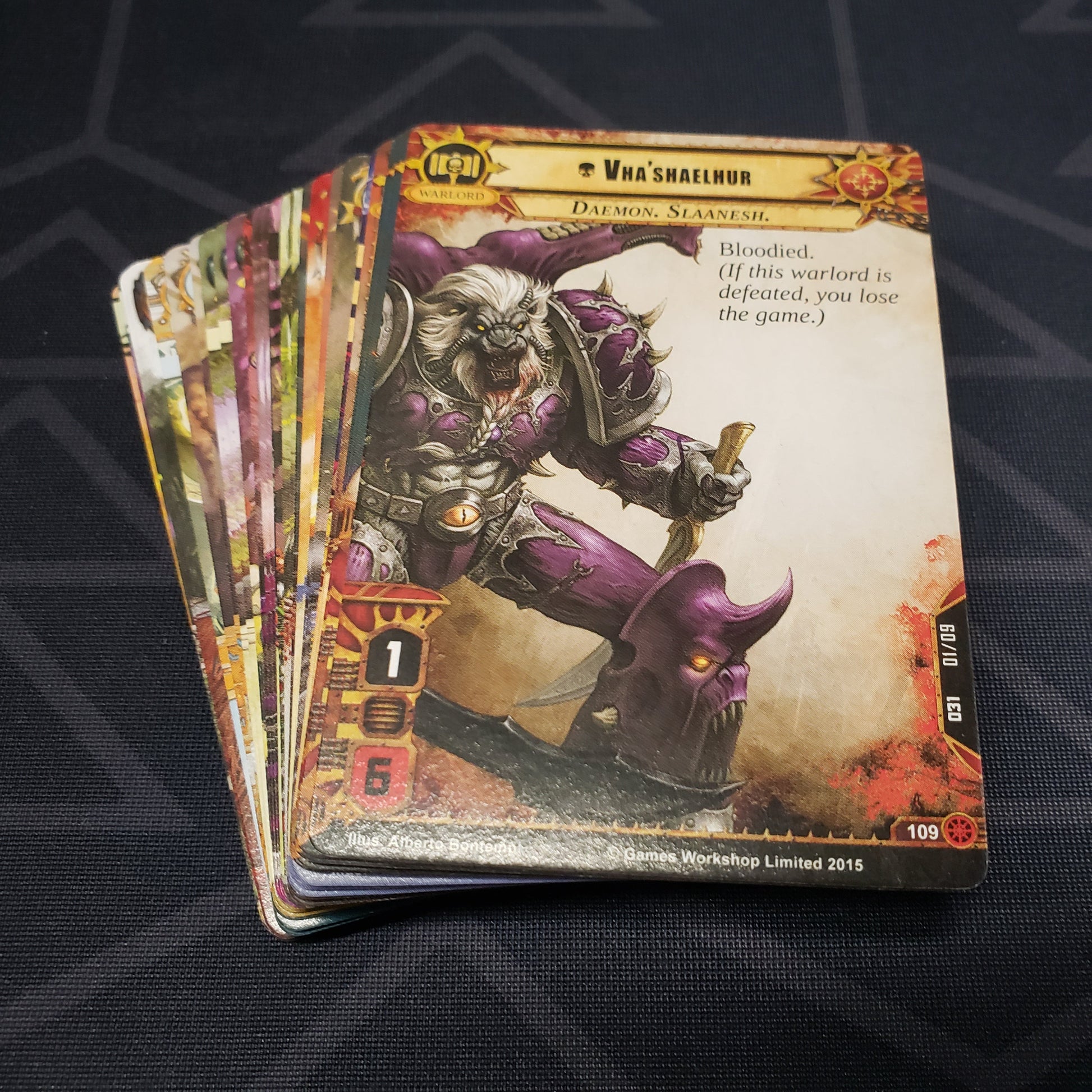 Image shows the cards for the Warp Unleashed expansion for the card game Warhammer 40K Conquest fanned out in a stack