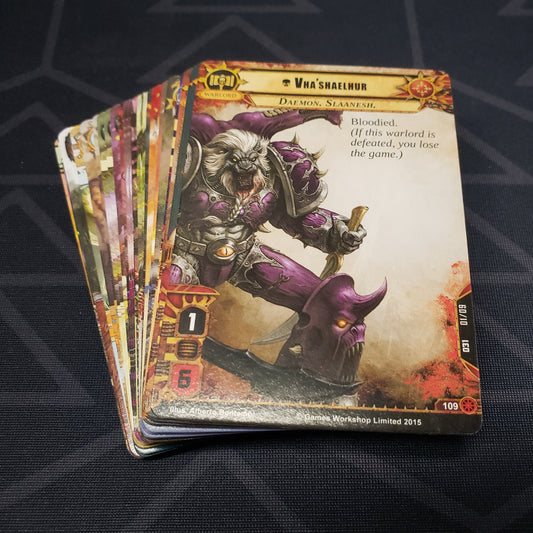 Image shows the cards for the Warp Unleashed expansion for the card game Warhammer 40K Conquest fanned out in a stack