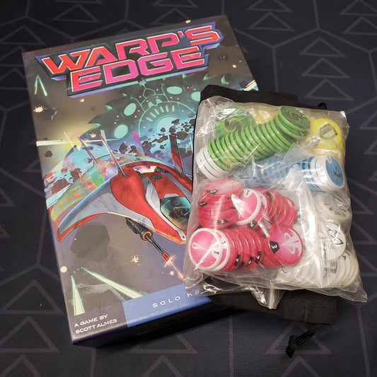 Image shows the front cover of the box of the Warp's Edge board game with a bag of upgraded tokens sitting on top of it