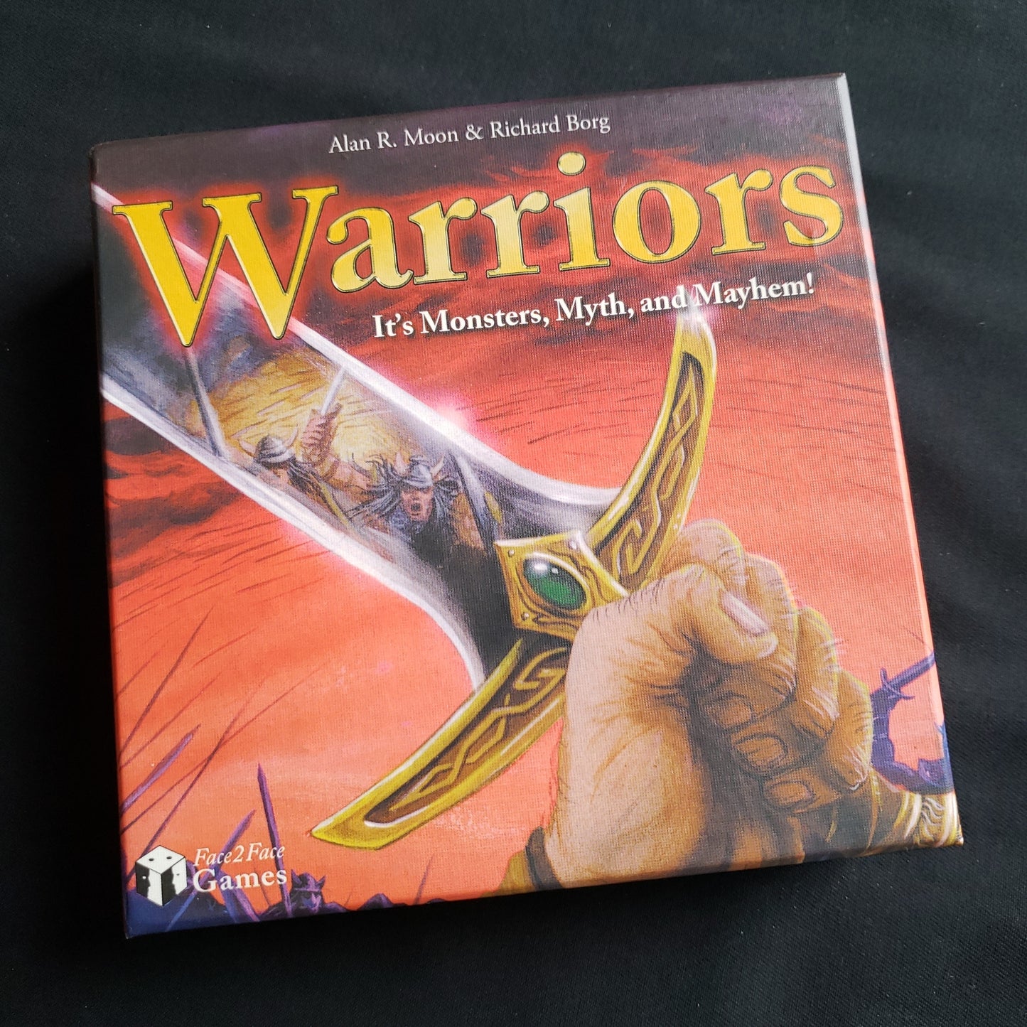 Image shows the front cover of the box of the Warriors card game