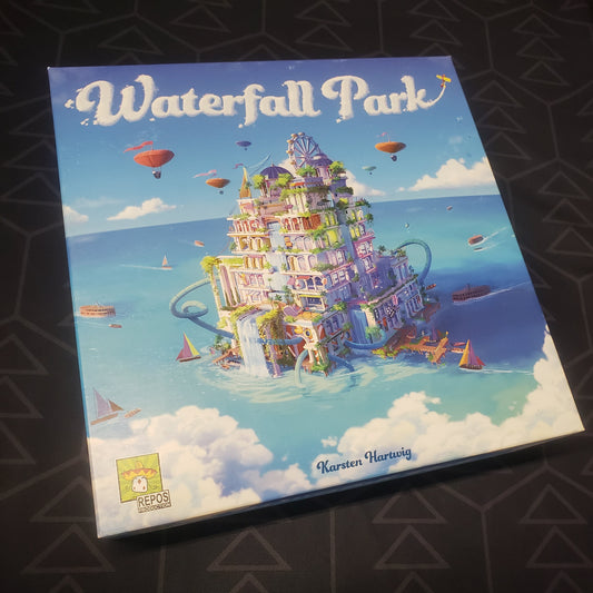 Image shows the front cover of the box for the Waterfall Park board game