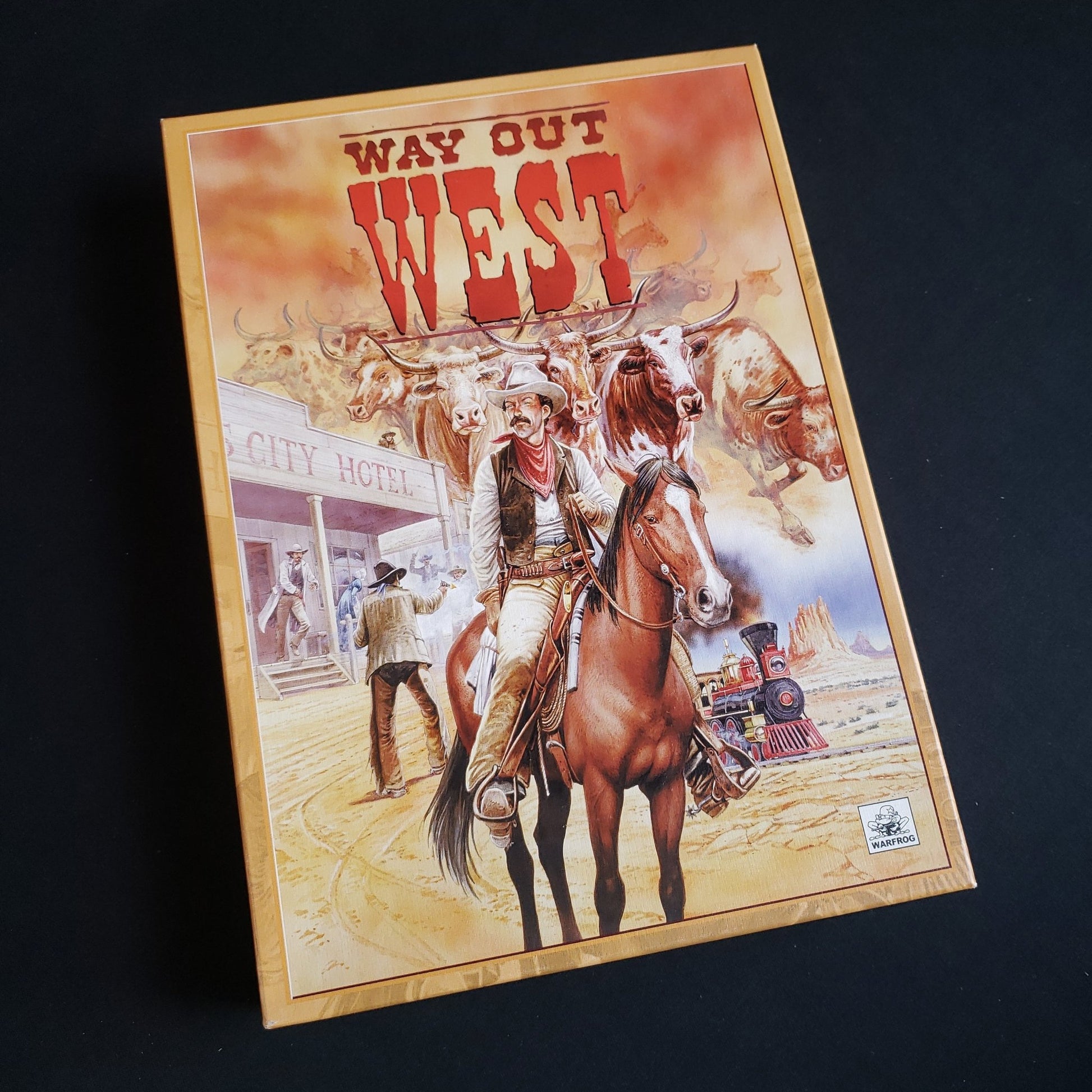 Image shows the front cover of the box of the Way Out West board game