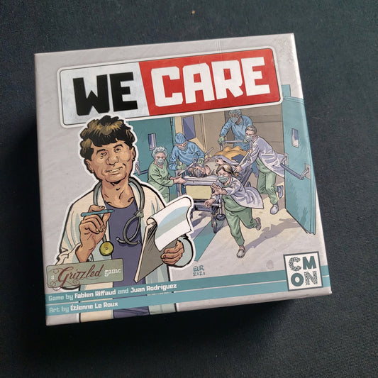 Image shows the front cover of the box of the We Care card game