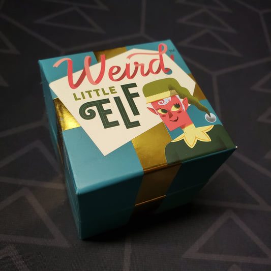 Image shows the top of the box for the Weird Little Elf party game