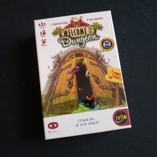 Image shows the front cover of the box of the Welcome to the Dungeon card game