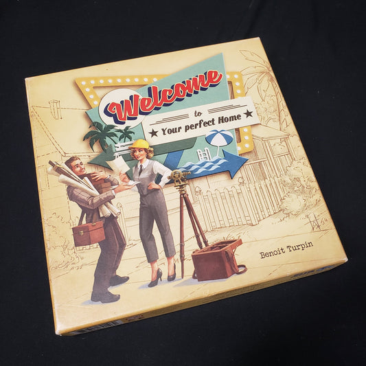 Image shows the front cover of the box of the Welcome To...  board game