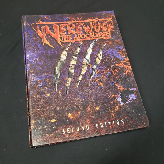 Image shows the front cover of the core rulebook for the roleplaying game Werewolf: the Apocalypse: Second Edition