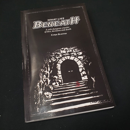 Image shows the front cover of the What Lies Beneath roleplaying game book
