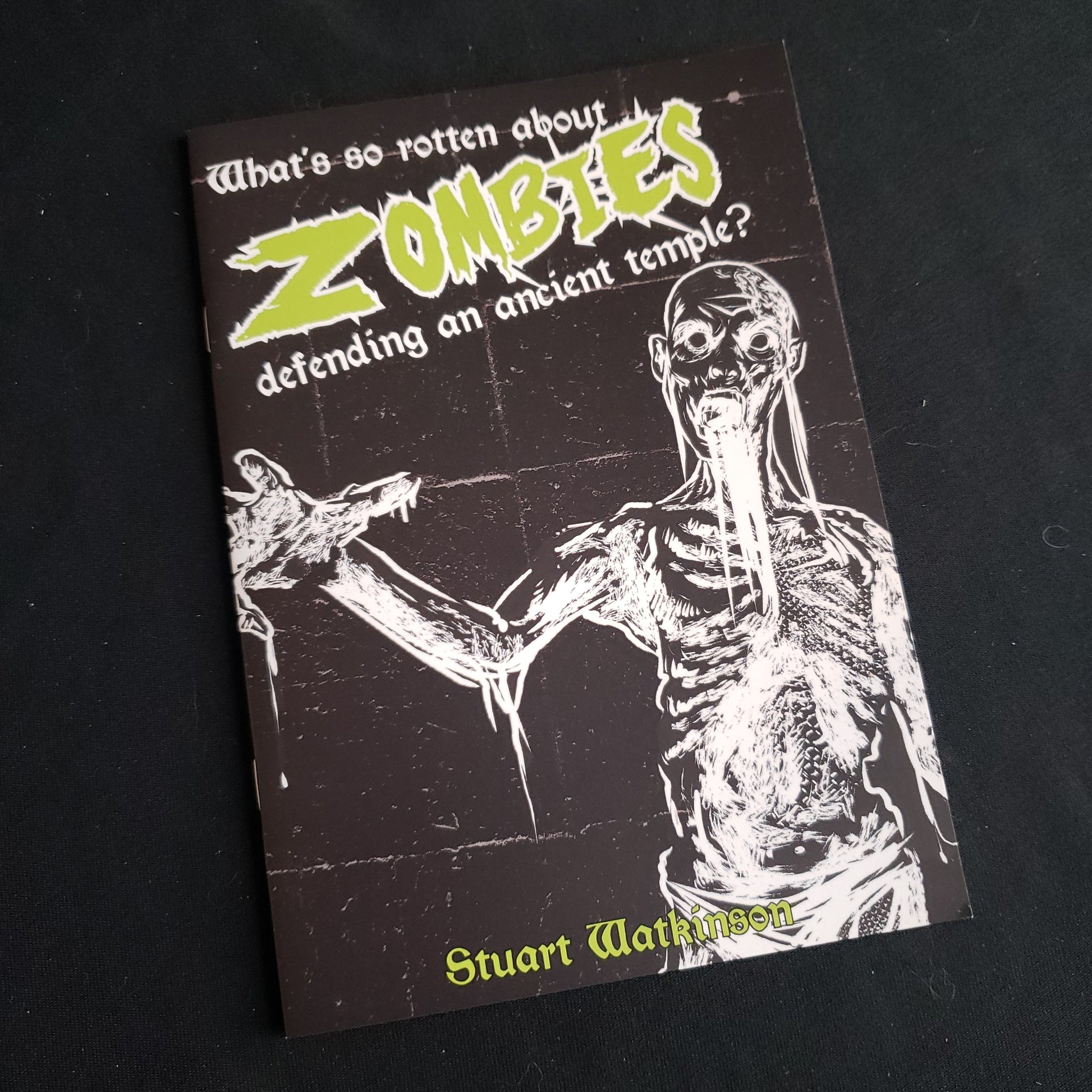 Image shows the front cover of the What's So Rotten About Zombies Defending an Ancient Temple? roleplaying game book