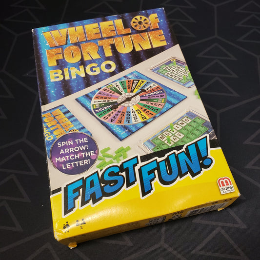 Image shows the front cover of the box of the board game Wheel of Fortune Bingo