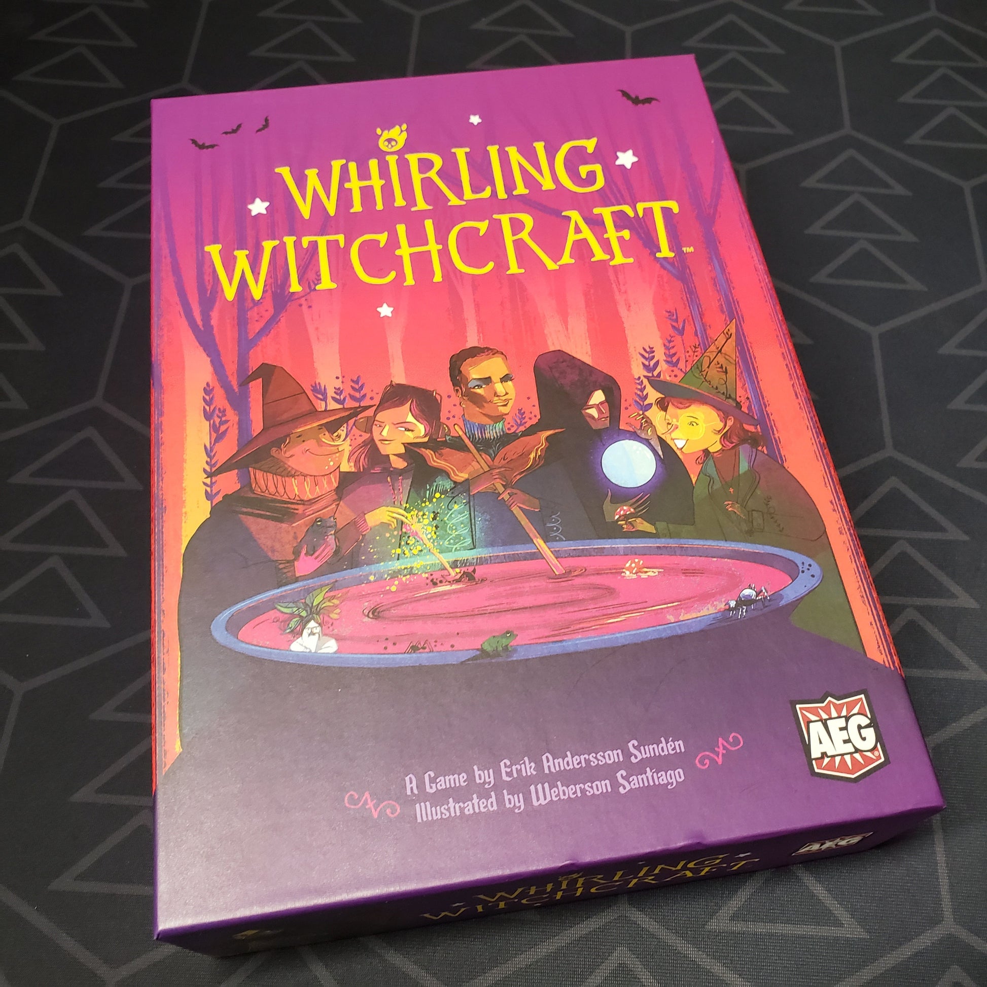 Image shows the front cover of the box of the Whirling Witchcraft board game