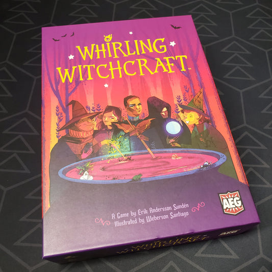 Image shows the front cover of the box of the Whirling Witchcraft board game