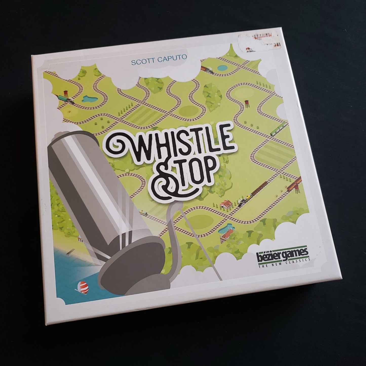 Image shows the front cover of the box of the Whistle Stop board game