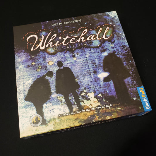 Image shows the front cover of the box of the Whitehall Mystery board game
