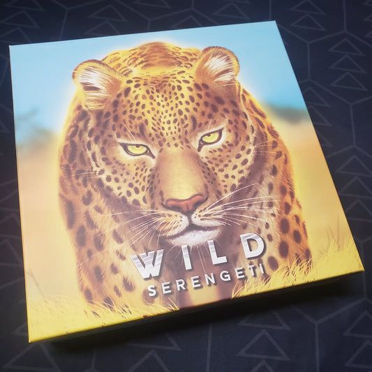 Image shows the front cover of the box for the Wild: Serengeti board game