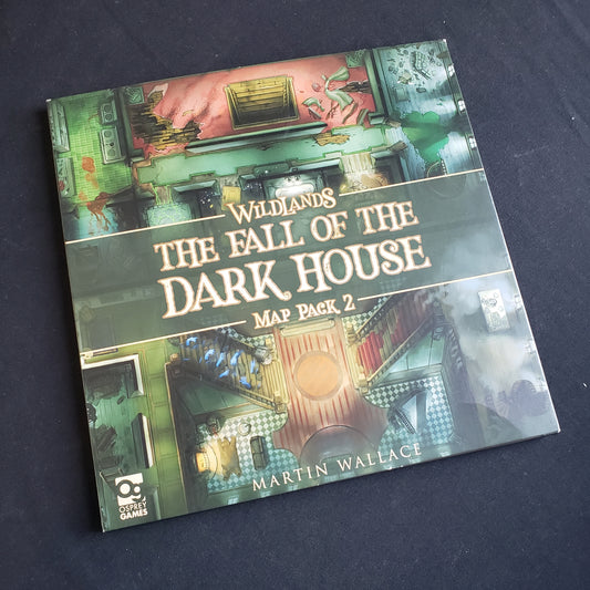 Image shows the front cover of the package of the Fall of the Dark House map pack for the board game Wildlands