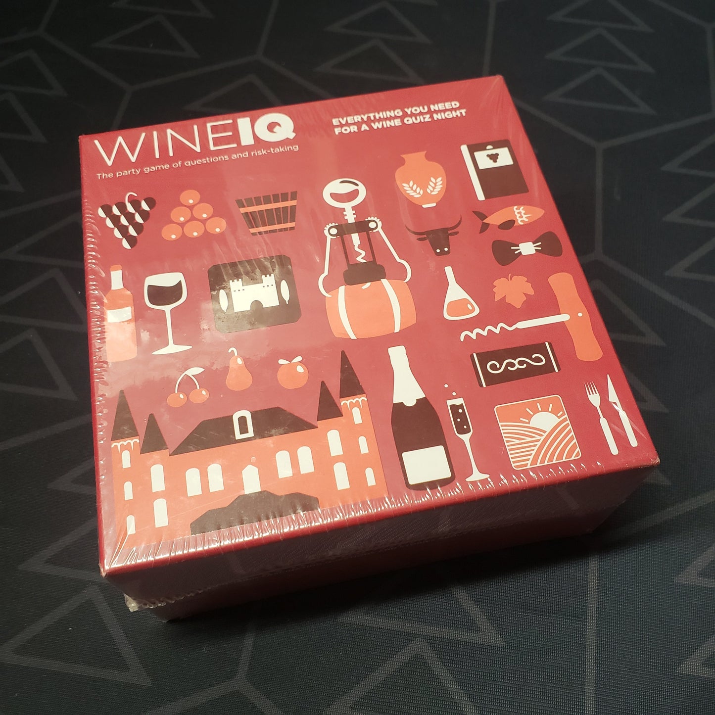 Image shows the front cover of the box of the WineIQ card game