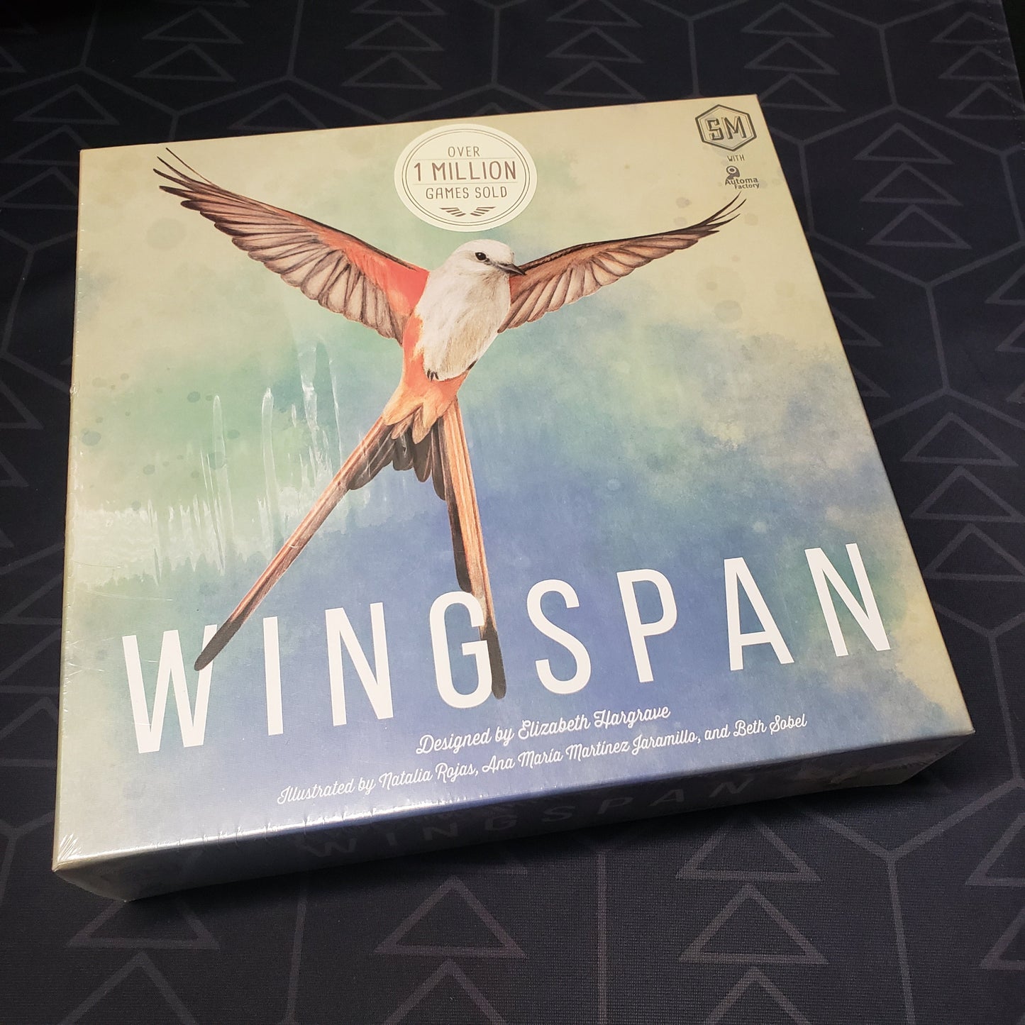 Image shows the front cover of the box of the Wingspan board game