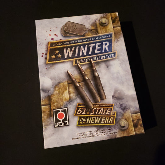 Image shows the front cover of the box of the Winter expansion for the card game 51st State