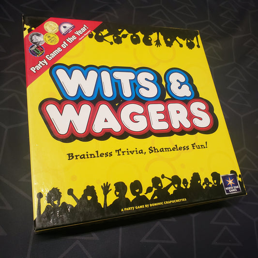 Image shows the front cover of the box for the party game Wits & Wagers
