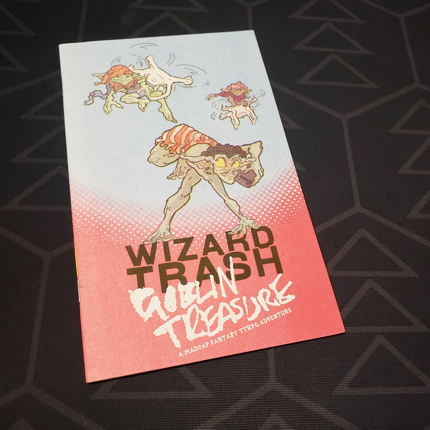 Image shows the front cover of the Wizard Trash, Goblin Treasure roleplaying game book