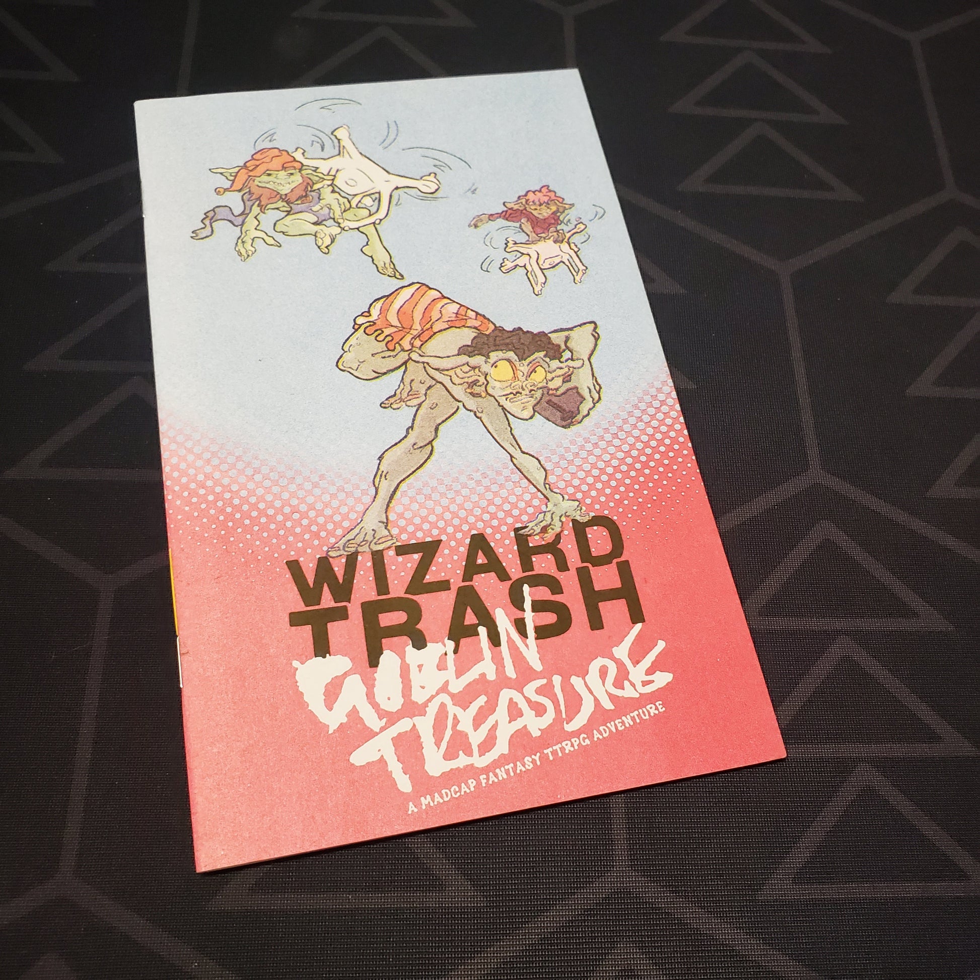 Image shows the front cover of the Wizard Trash, Goblin Treasure roleplaying game book