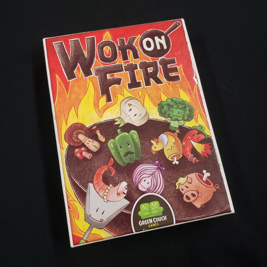 Image shows the front cover of the box of the Wok On Fire board game
