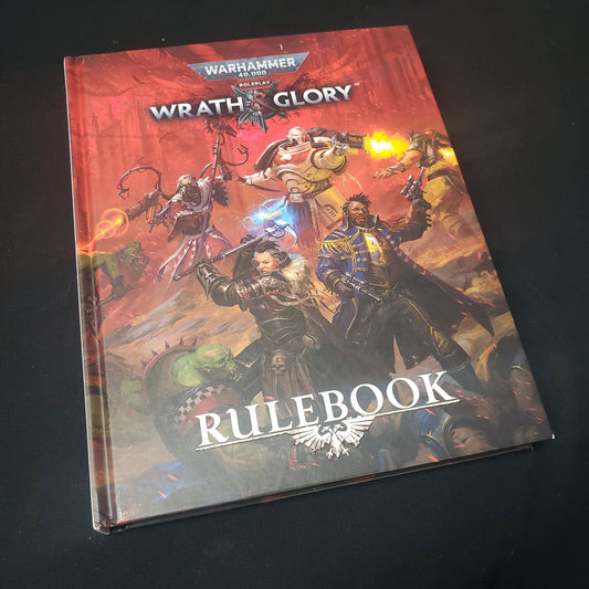 Image shows the front cover of the core rulebook for the roleplaying game Wrath & Glory