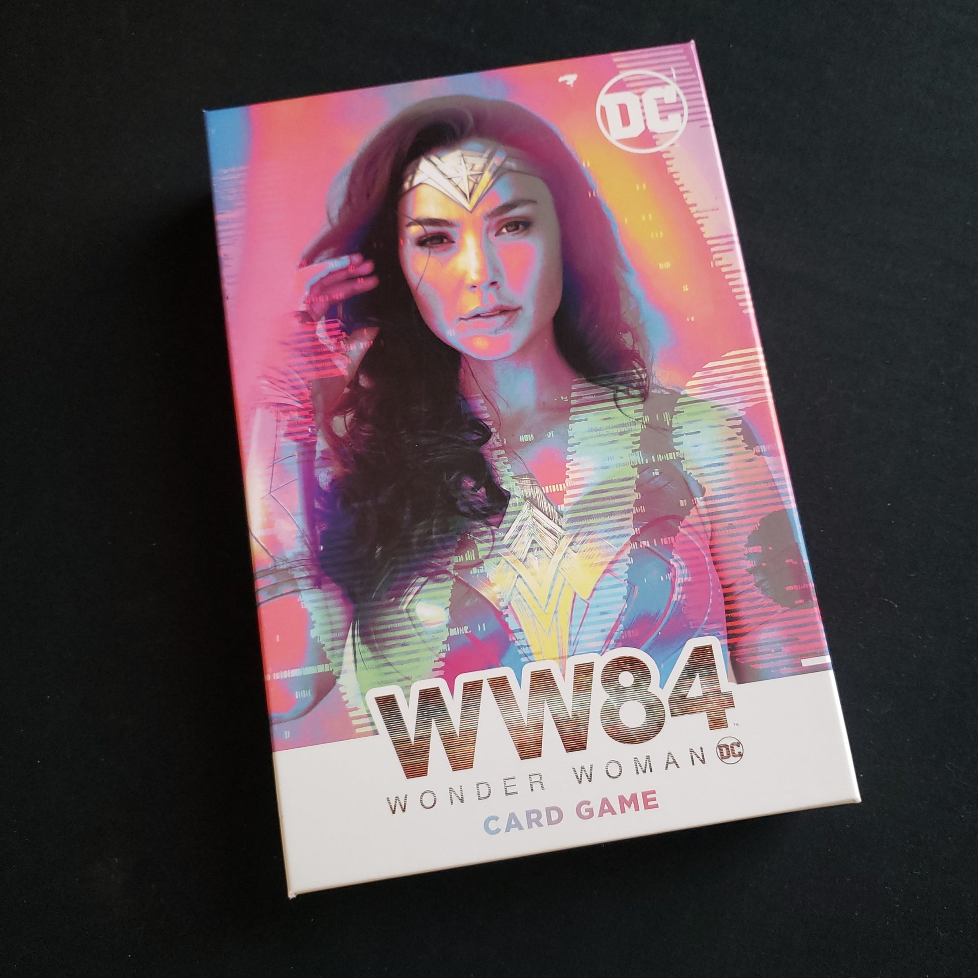 Image shows the front cover of the box of the WW84: Wonder Woman Card Game