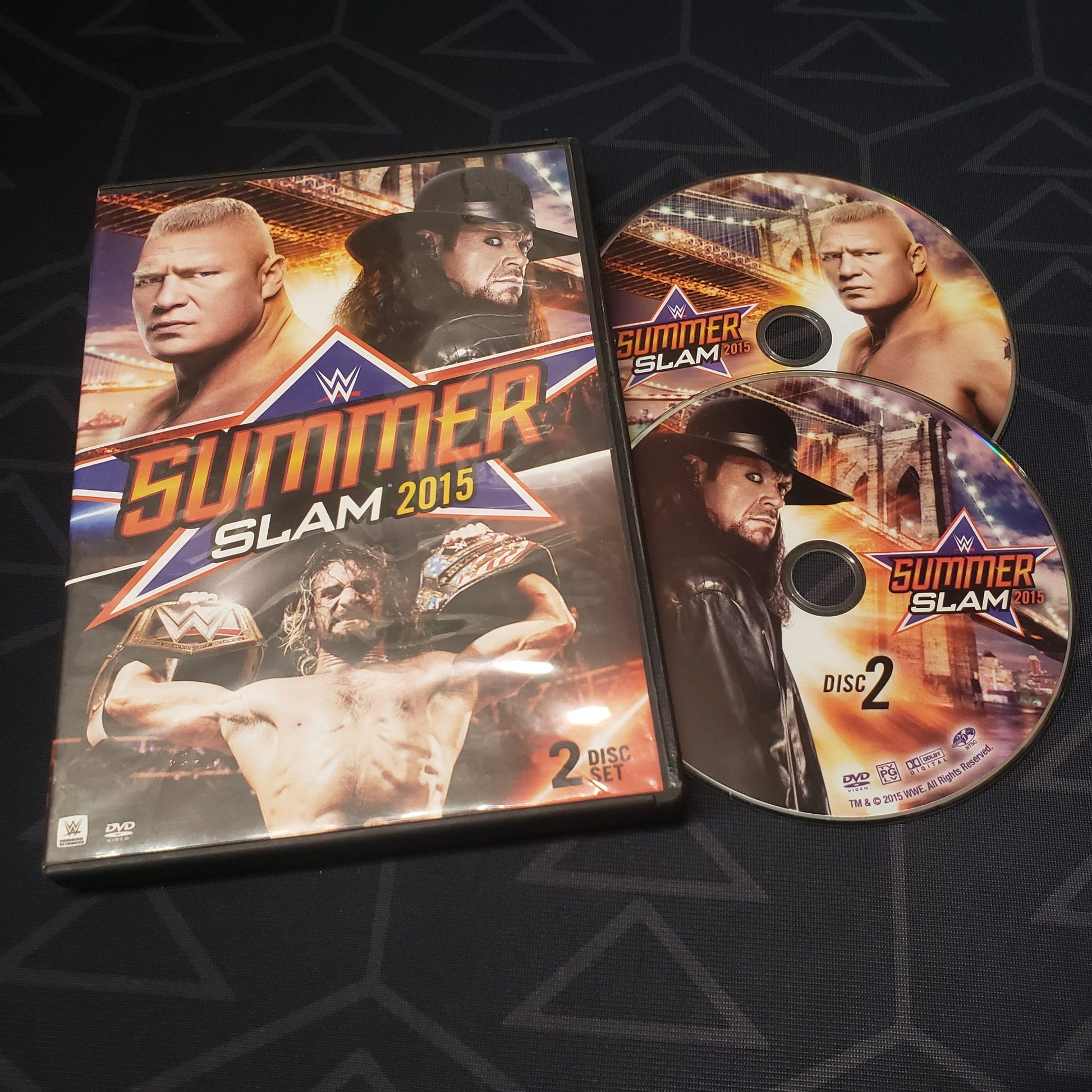 Image shows the case & two discs for WWE Summerslam 2015 on DVD