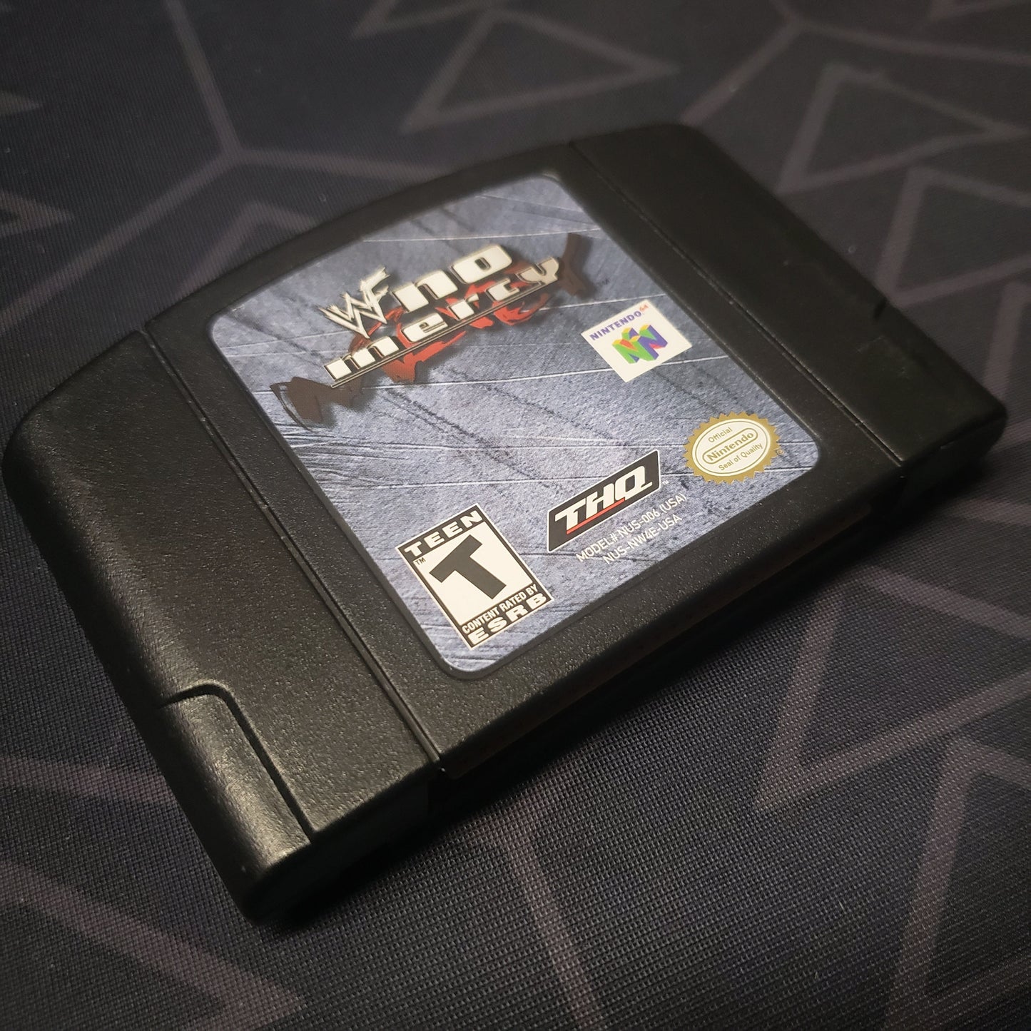 Image shows the front of the cartridge for the video game WWF No Mercy for the Nintendo 64