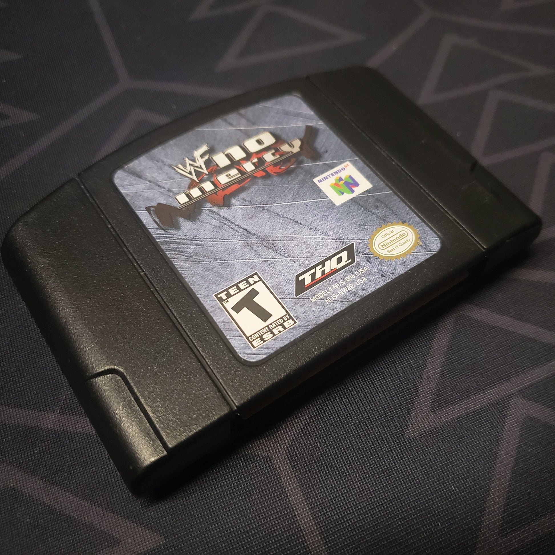 Image shows the front of the cartridge for the video game WWF No Mercy for the Nintendo 64
