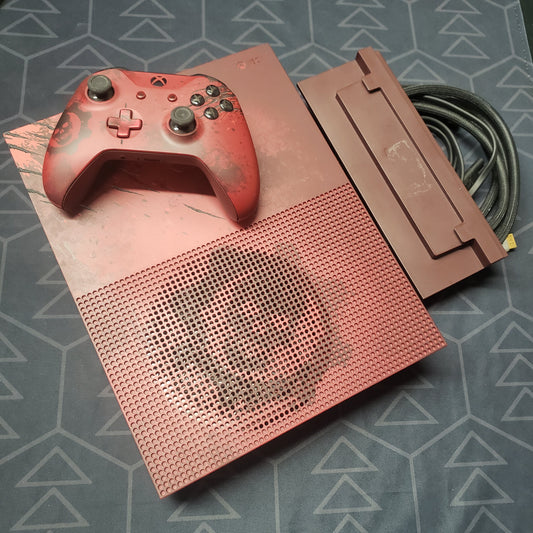 Image shows the top of a Xbox One S Gears of War 4 Limited Edition gaming console with a matching controller and stand