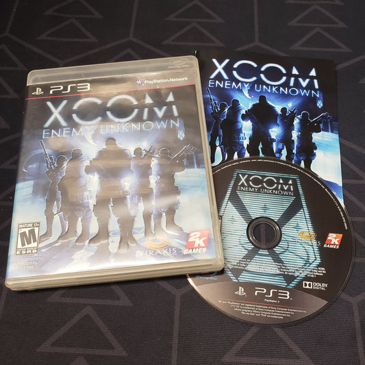 Image shows the case, manual and disc for the video game XCOM: Enemy Unknown for Playstation 3
