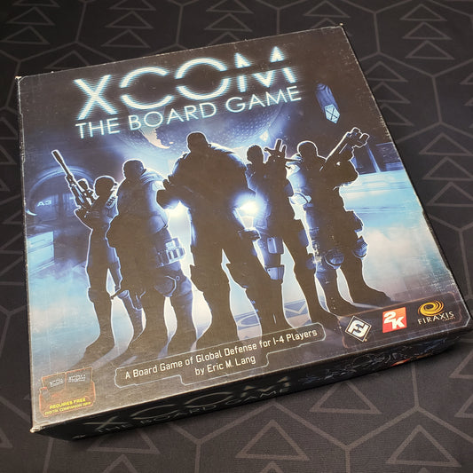 Image shows the front cover of the box of XCOM: The Board Game