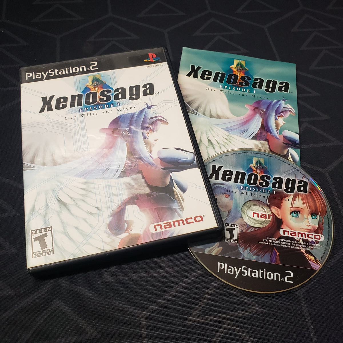Image shows the case, manual and disc for the video game Xenosaga: Episode 1 for Playstation 2