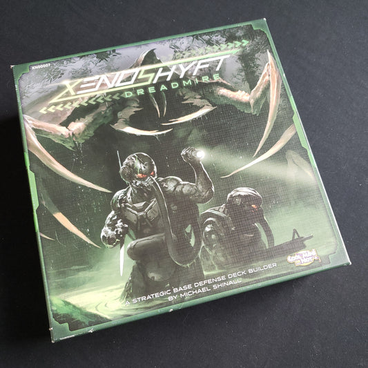 Image shows the front cover of the box of the XenoShyft: Dreadmire board game