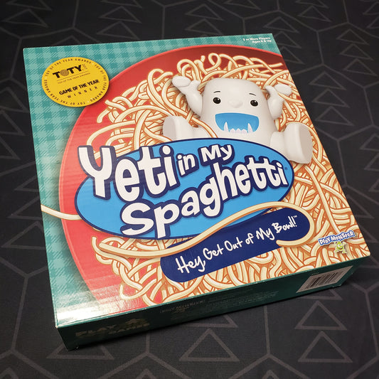 Image shows the front cover of the box for the Yeti in My Spaghetti board game