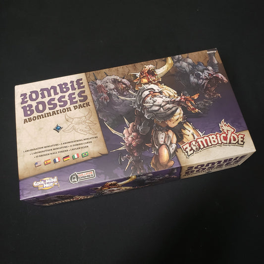 Image shows thefront of the box for the Zombie Bosses Abomination Pack for the board game Zombicide: Black Plague