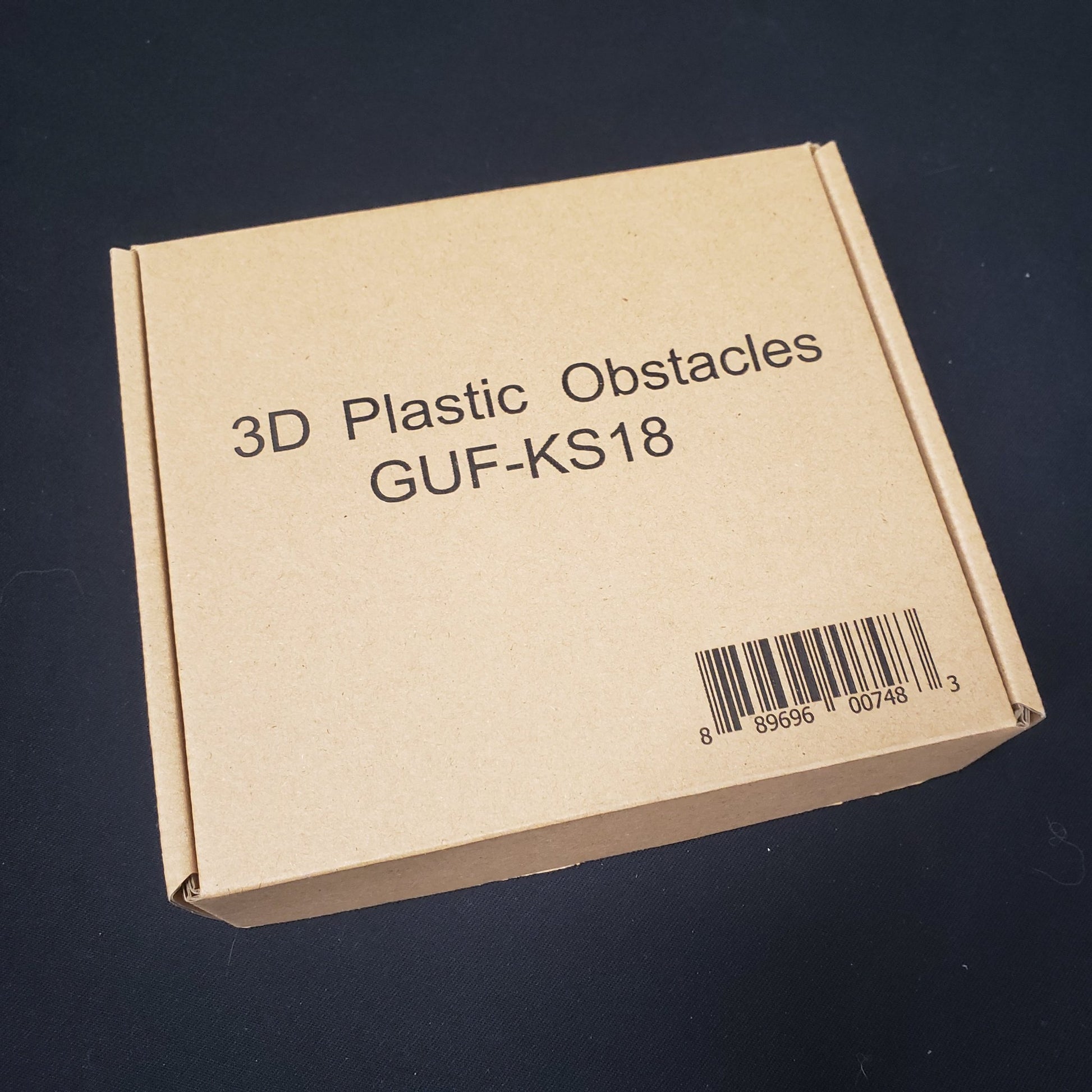 Image shows the front of the box for the 3D Plastic Obstacles upgrade for the board games Zombicide: Black Plague & Green Horde