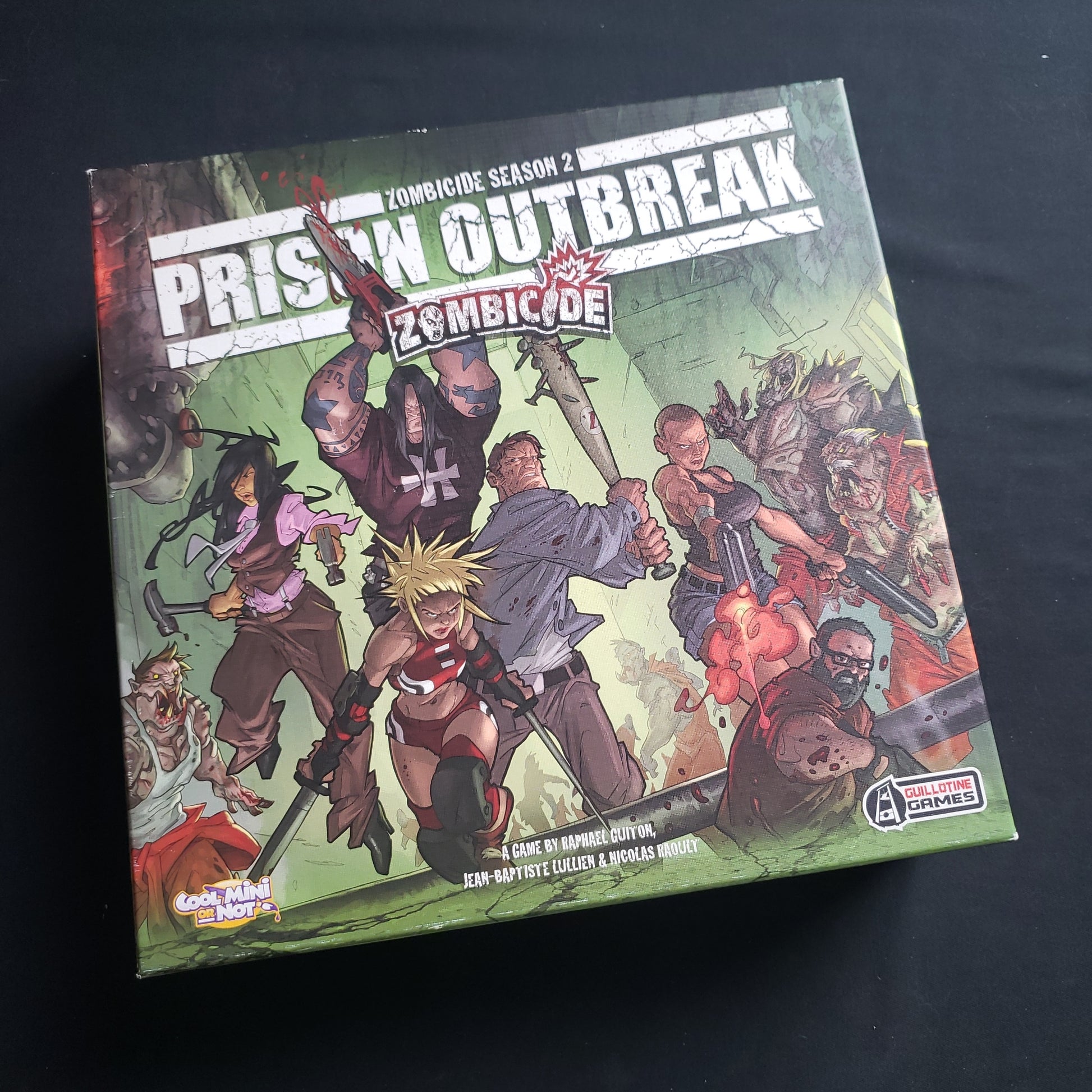 Image shows the front cover of the box of the Zombicide Season 2: Prison Outbreak board game