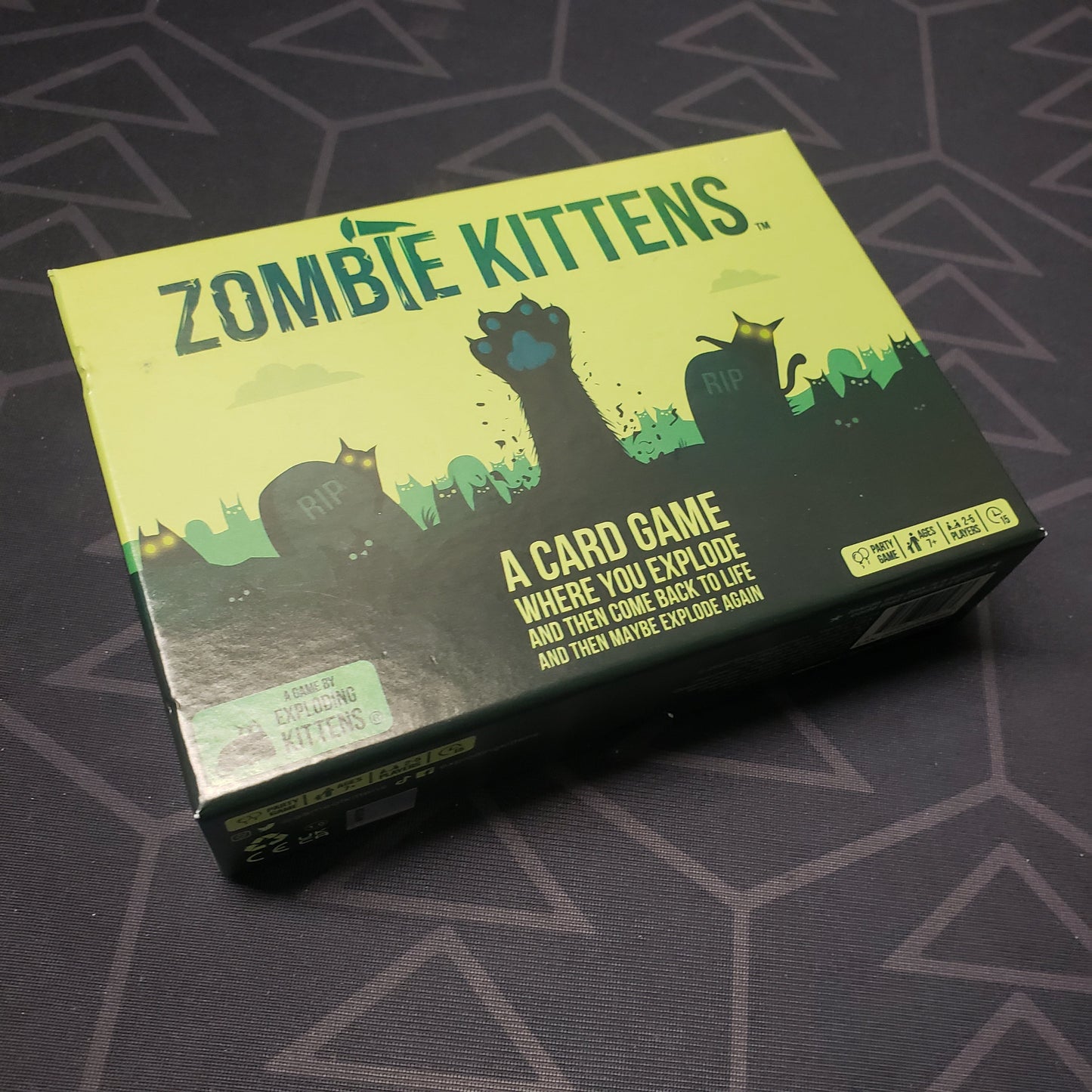Image shows the front cover of the box for the Zombie Kittens card game