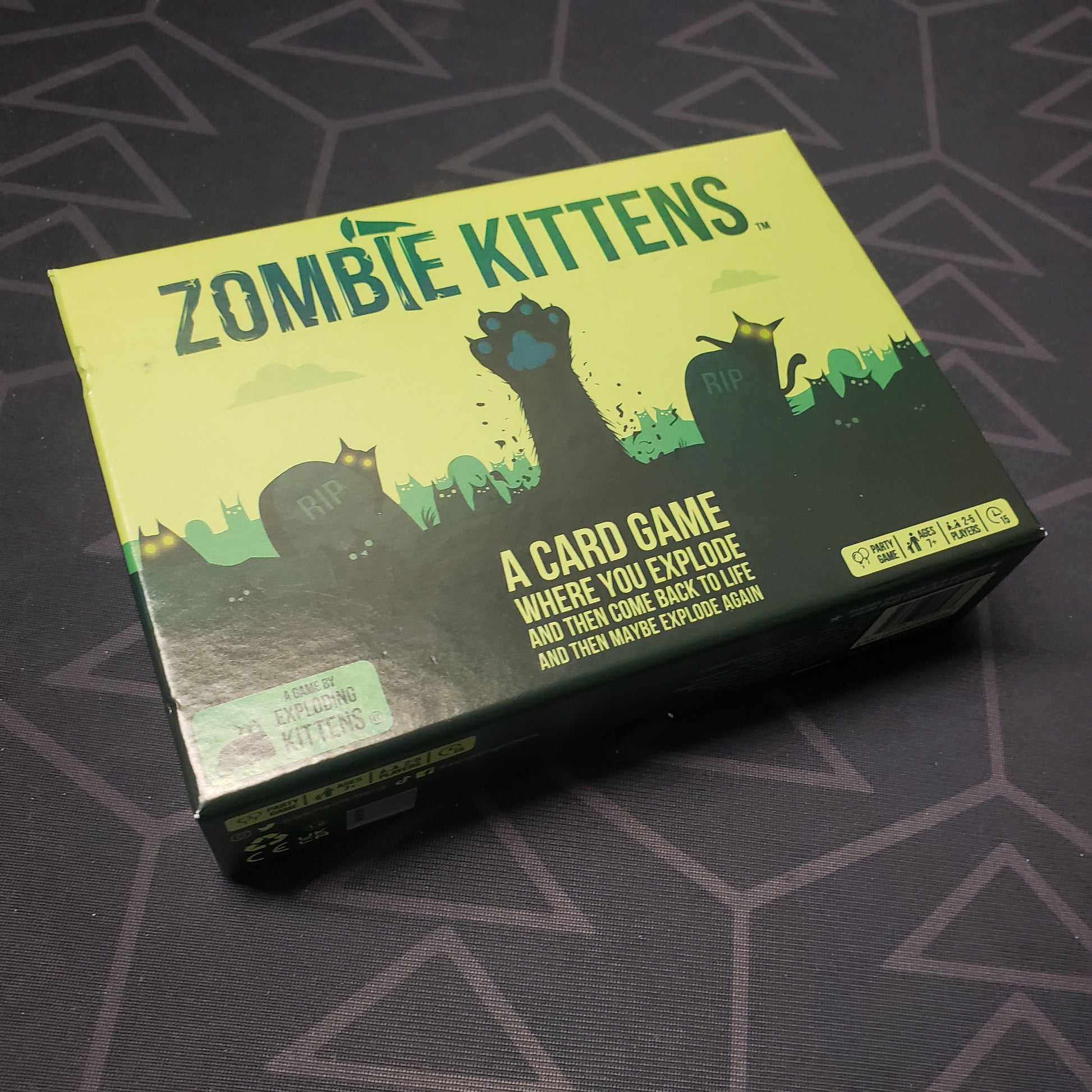 Image shows the front cover of the box for the Zombie Kittens card game