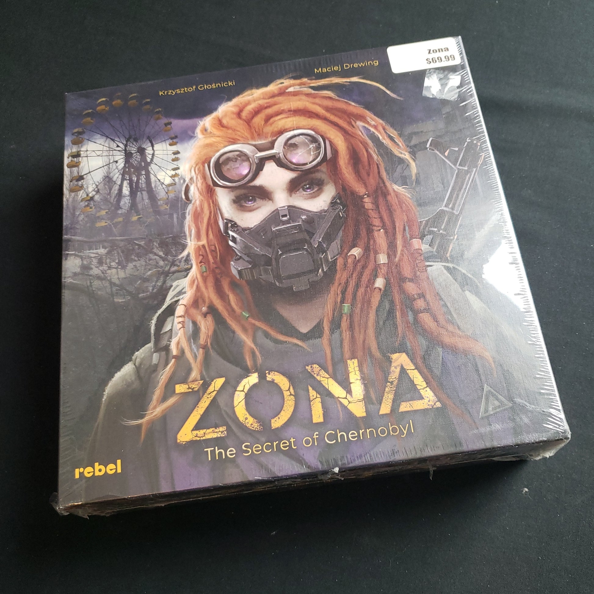 Image shows the front cover of the box of the Zona: Secret of Chernobyl board game