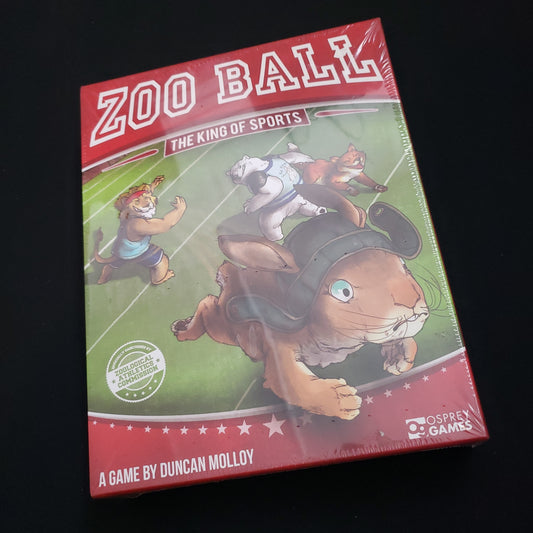 Image shows the front cover of the box of the Zoo Ball board game