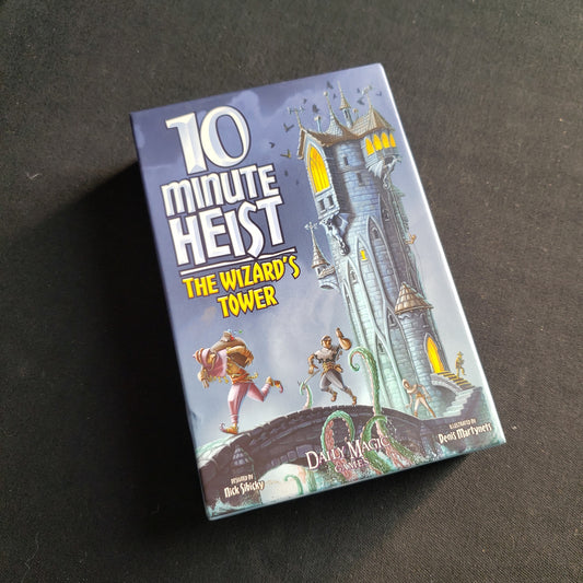 Image shows the front cover of the box of the 10 Minute Heist: The Wizard's Tower card game